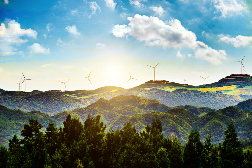 Sustainable development Windmills on a series of distant hills